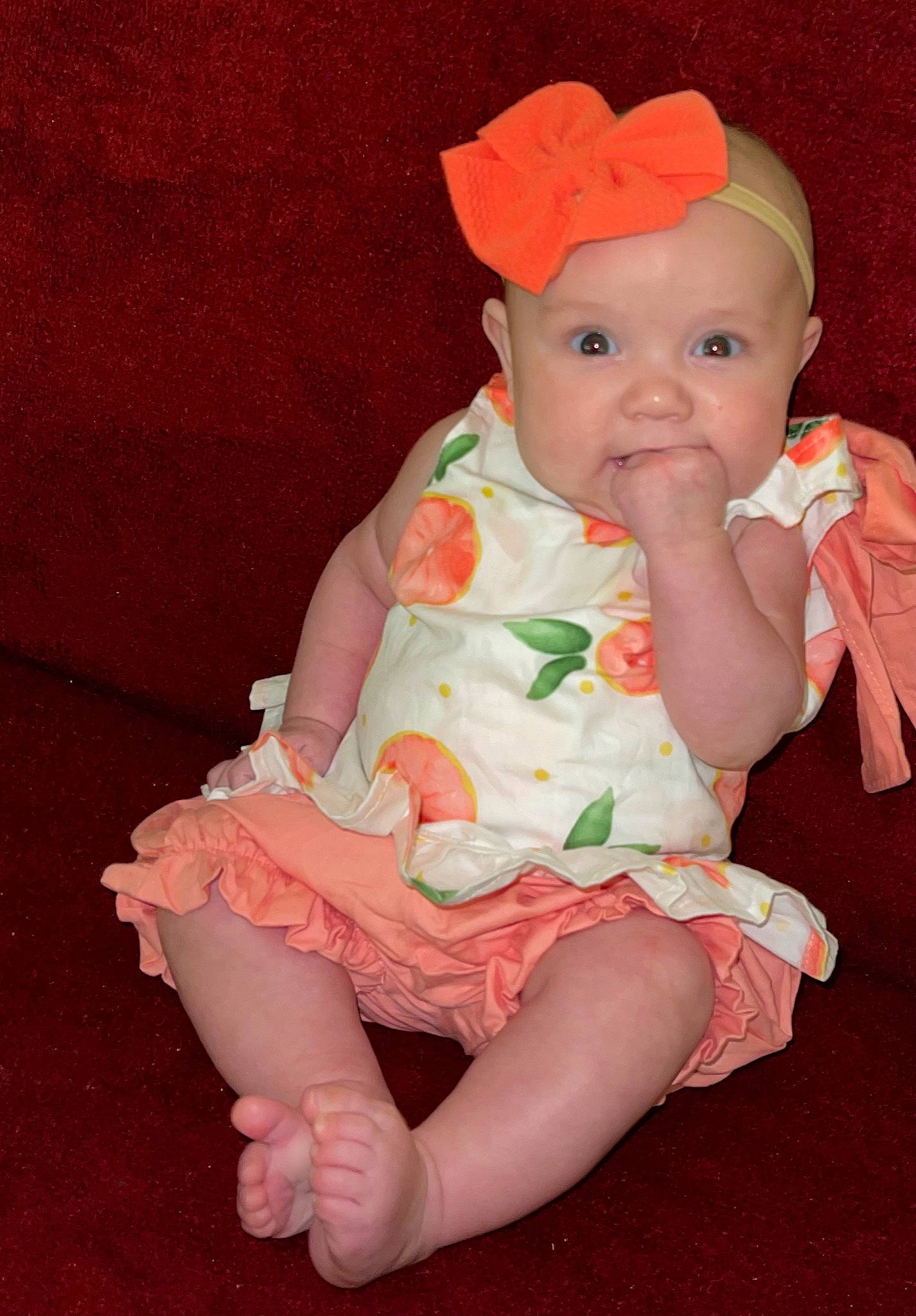 Meredith is registered to the contest to win money with this photo: baby, baby_toddler_clothing, cap, cheek, child, dress, embellishment, eye, fashion_accessory, fun, head, headwear, human_body, human_leg, pattern, peach, person, pink, skin, sleeve