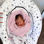 Delilah joined the competition — help win amazing prizes! baby, newborn, blanket, pink, sleeping, baby_rocker, star_pattern, carpet, infant, cozy, wrapped, indoors, peaceful, cute, child, soft, resting, fisher_price, home, comfort