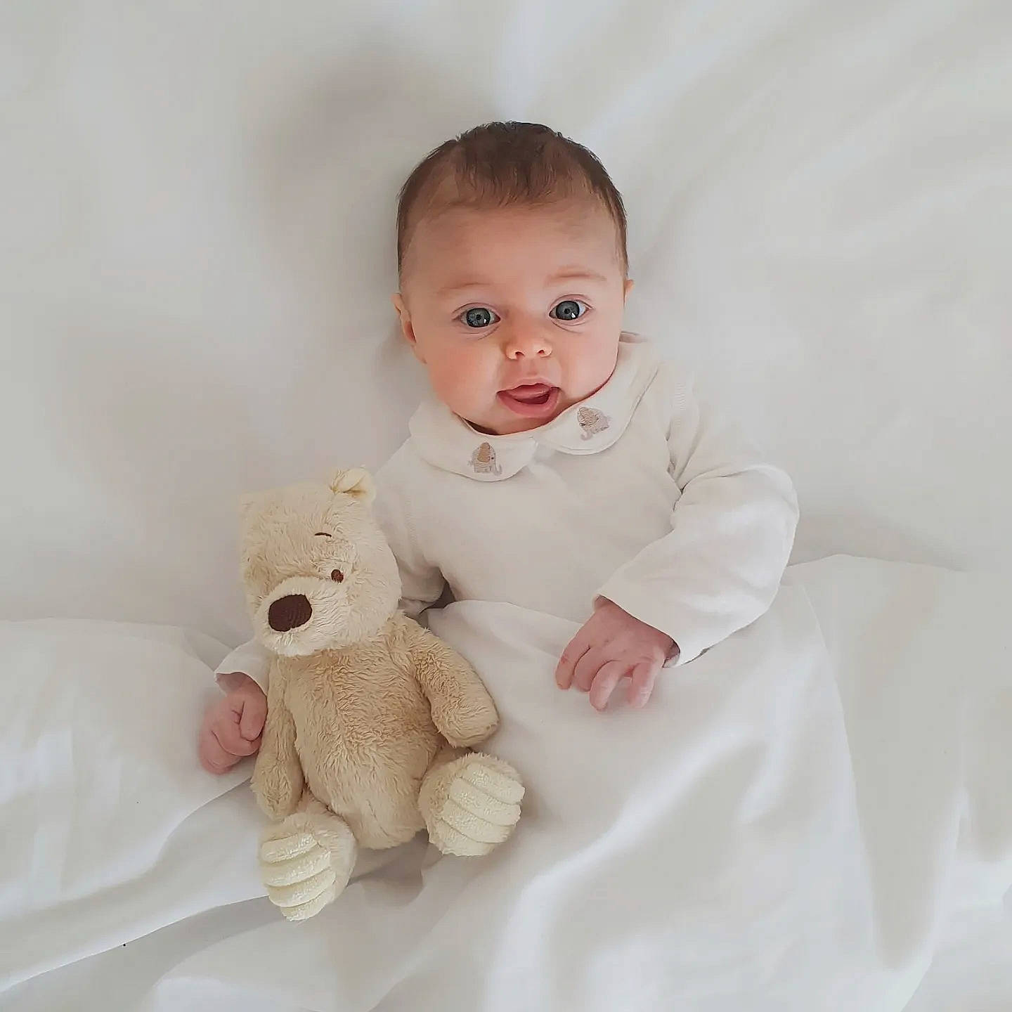 Amelie joined the competition — help win amazing prizes! baby, baby_toddler_clothing, cheek, comfort, eye, face, flash_photography, gesture, hand, happy, head, human_body, mammal, nose, person, skin, sleeve, stuffed_toy, surprise, teddy_bear