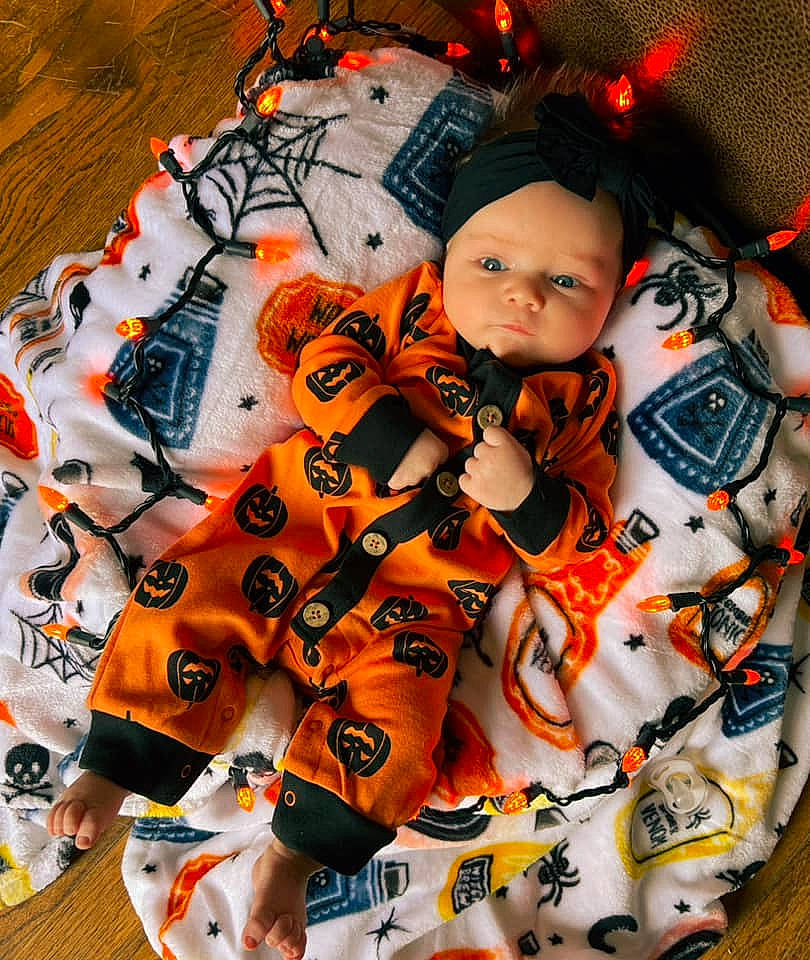 Jaylee is registered to the contest to win money with this photo: art, baby, baby_products, baby_toddler_clothing, carmine, child, comfort_food, craft, fashion_accessory, font, headwear, linens, orange, pattern, peach, person, personal_protective_equipment, sleeve, symmetry, textile