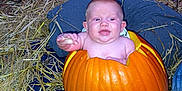 Lyric is registered to the contest to win money with this photo: baby, pumpkin, carved_pumpkin, autumn, hay, leaves, outdoor, child, cute, fall, orange, person, hand, costume, seasonal, nature, funny, holiday, celebration, smiling