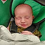 Lyric joined the competition — help win amazing prizes! baby, infant, sleeping, car_seat, blanket, green, child, face, hand, clothing, rest, cute, peaceful, indoors, safety_harness, newborn, soft, toddler, seat, portrait