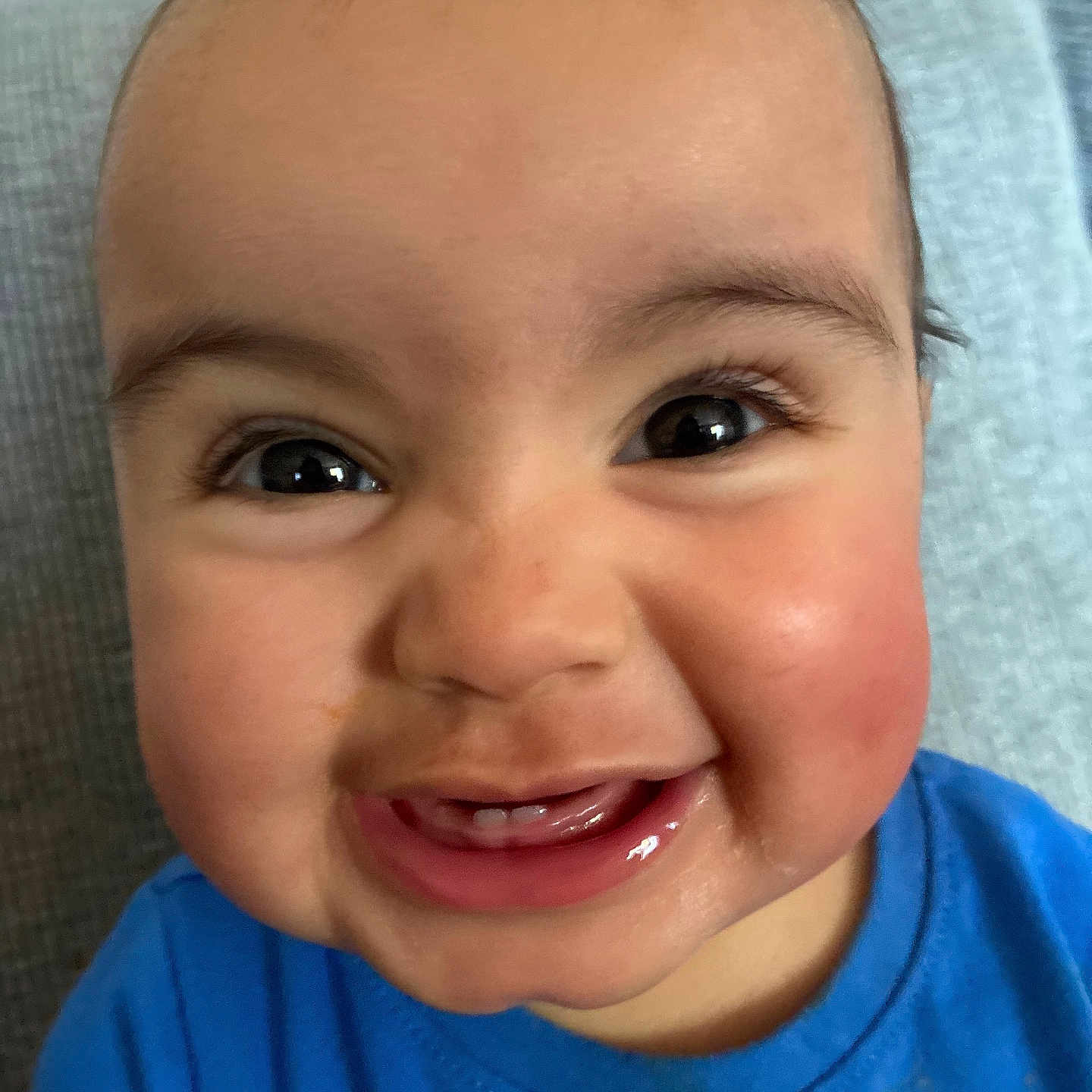 Haisley is registered to the contest to win money with this photo: baby, child, face, smile, teeth, blue_shirt, eyes, cheeks, skin, portrait, cute, happy, infant, closeup, expression, person, young, indoors, clothing, mischievous