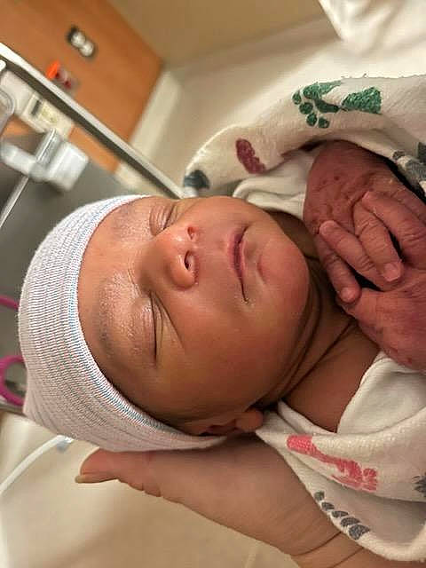 Braxton is registered to the contest to win money with this photo: abdomen, baby, cheek, chest, child, childbirth, comfort, ear, eyebrow, eyelash, facial_expression, happy, headwear, hospital, mouth, neck, nose, patient, person, skin