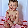 Elijah is registered to the contest to win money with this photo: baby, infant, diaper, kiss_marks, lipstick, pink_blanket, heart_pattern, smiling, sitting, portrait, face, cheeks, hands, toes, skin, indoor, studio_background, blue_eyes, cute, chubby