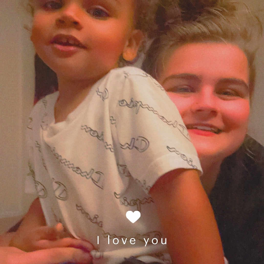 Xavier is registered to the contest to win money with this photo: accessories, baby, bodypart, clothing, face, finger, hand, happy, head, indoors, jewelry, mouth, people, person, photography, portrait, ring, shorts, smile, t_shirt