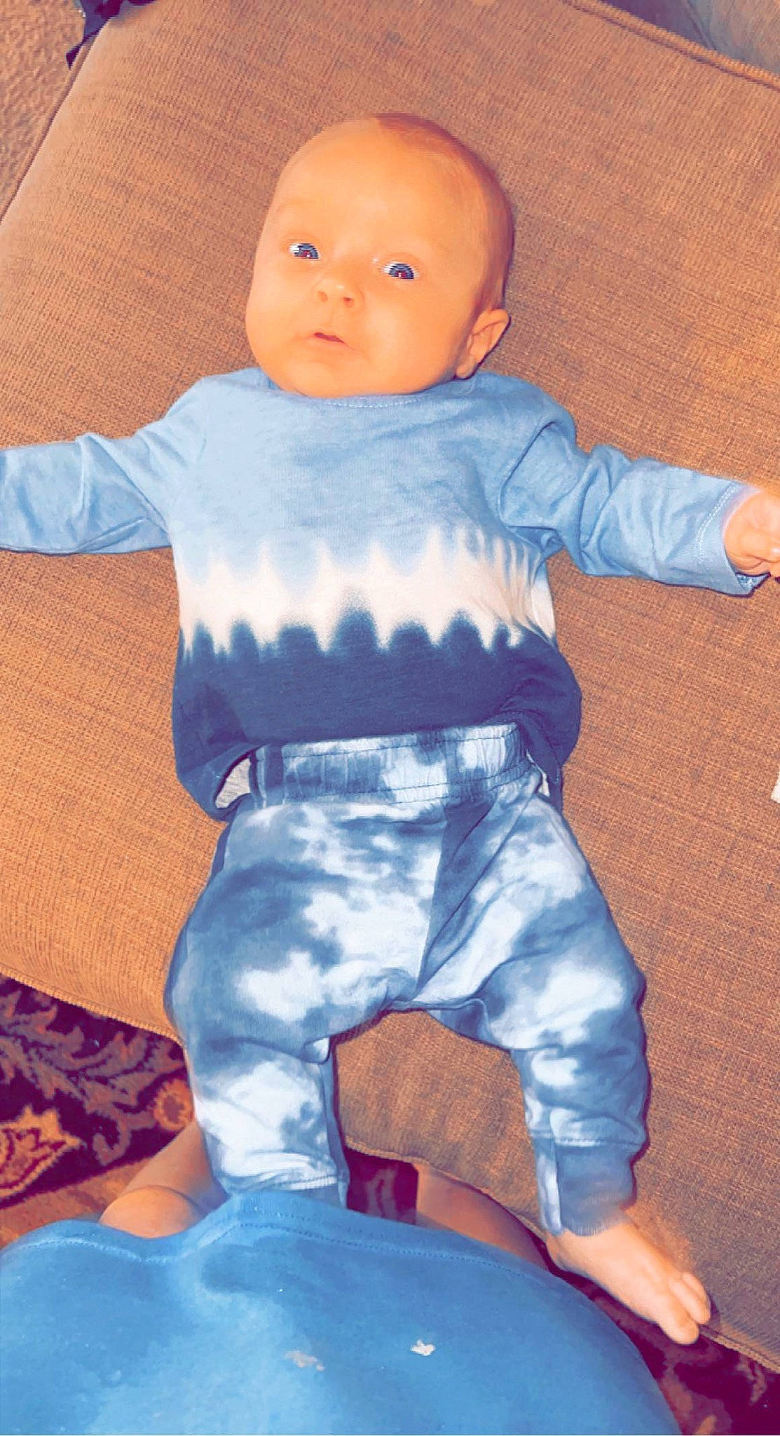 Dallas is registered to the contest to win money with this photo: arm, baby_toddler_clothing, cheek, child, chin, comfort, doll, electric_blue, eye, hand, head, human_body, joint, orange, person, skin, sleeve, thigh, thumb, toy