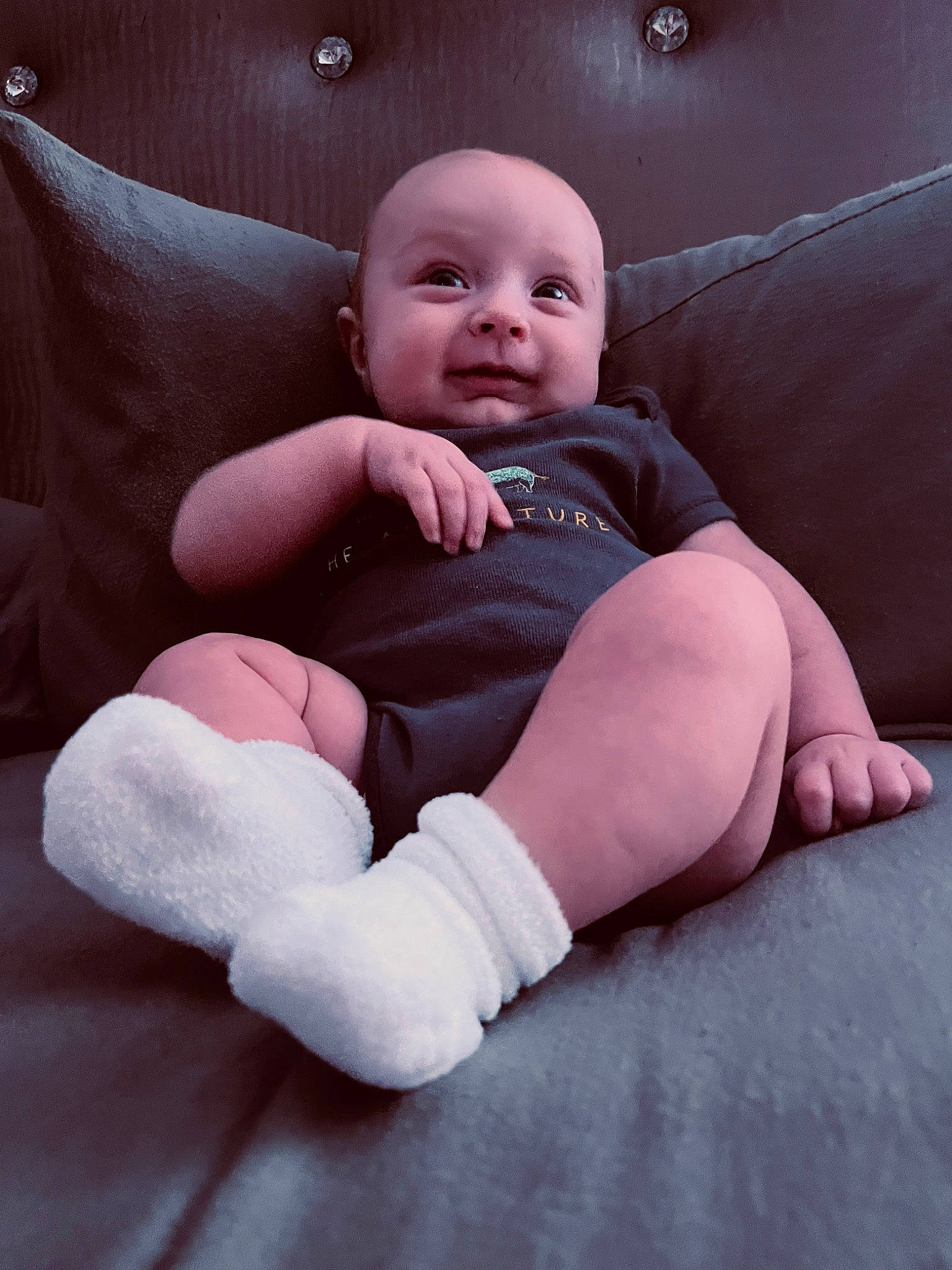 Dallas is registered to the contest to win money with this photo: arm, baby, baby_toddler_clothing, cheek, comfort, eye, face, finger, flash_photography, head, iris, joint, leg, lip, mouth, person, pink, shoulder, skin, smile