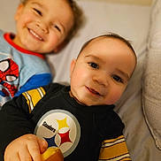 Zai'Vion is registered to the contest to win money with this photo: baby, bed, bodypart, clothing, couch, face, finger, furniture, hand, happy, head, laughing, mouth, person, photography, portrait, smile, t_shirt, teeth, toy
