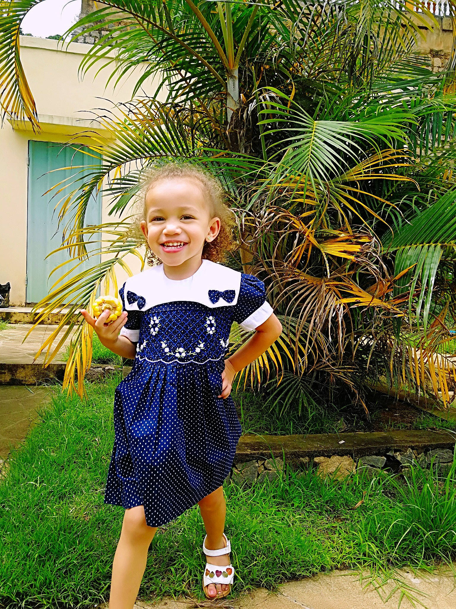 Ayanna participe au concours pour gagner de l'argent avec cette photo : child, child_model, clothing, dress, electric_blue, happy, joy, majorelle_blue, pattern, person, photography, plant, shoe, smile, summer, toddler, tree, vacation