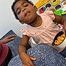 toddler, child, snacking, pink_dress, goldfish_crackers, bowl, toys, animal_hospital, indoor, playset, person, hand, leg, patterned_leggings, cute, happy, food, candid, family, young_child