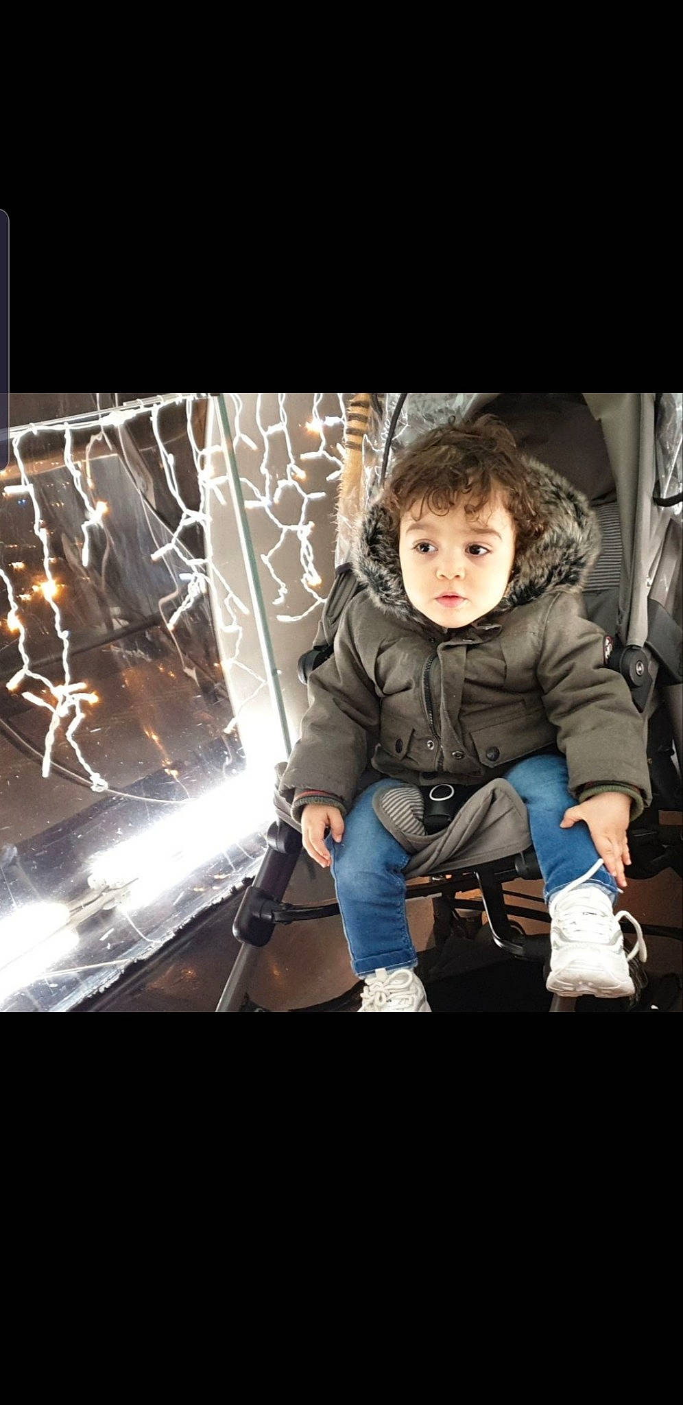 Djoud participe au concours pour gagner de l'argent avec cette photo : baby, child, darkness, denim, electric_blue, fire, flash_photography, fun, fur, glass, happy, heat, hoodie, luxury_vehicle, mammal, person, portrait_photography, recreation, room, sitting