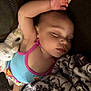 Myla joined the competition — help win amazing prizes! baby, sleeping, plush_toy, blanket, infant, child, cozy, couch, resting, peaceful, face, arm, colorful_clothing, soft, indoor, portrait, cute, relaxed, comfort, toddler
