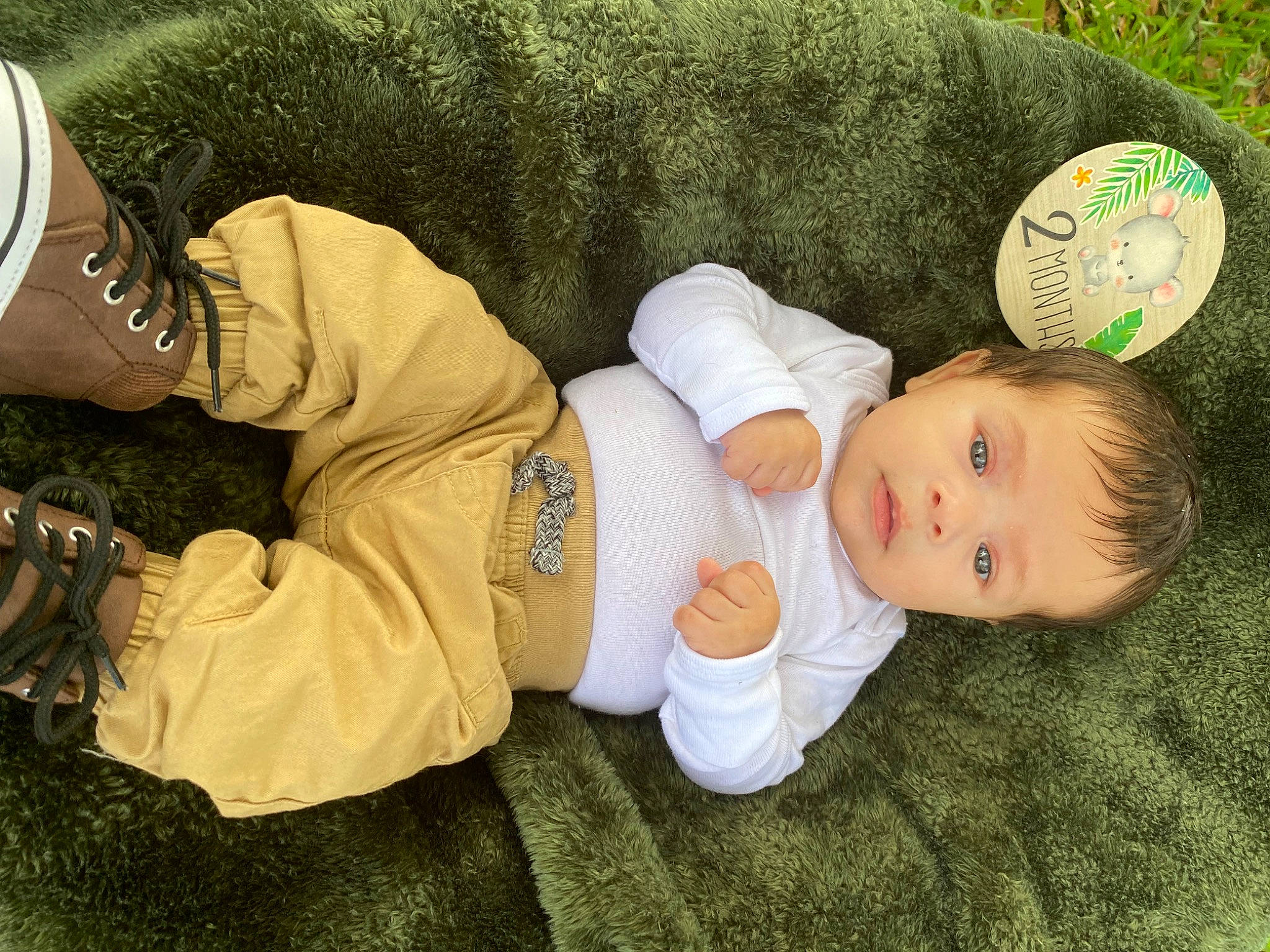Nazario is registered to the contest to win money with this photo: baby, baby_sleeping, baby_toddler_clothing, child, comfort, foot, grass, happy, hat, human_leg, knee, lap, nap, person, sitting, sleeve, sock, thigh, toddler, tree