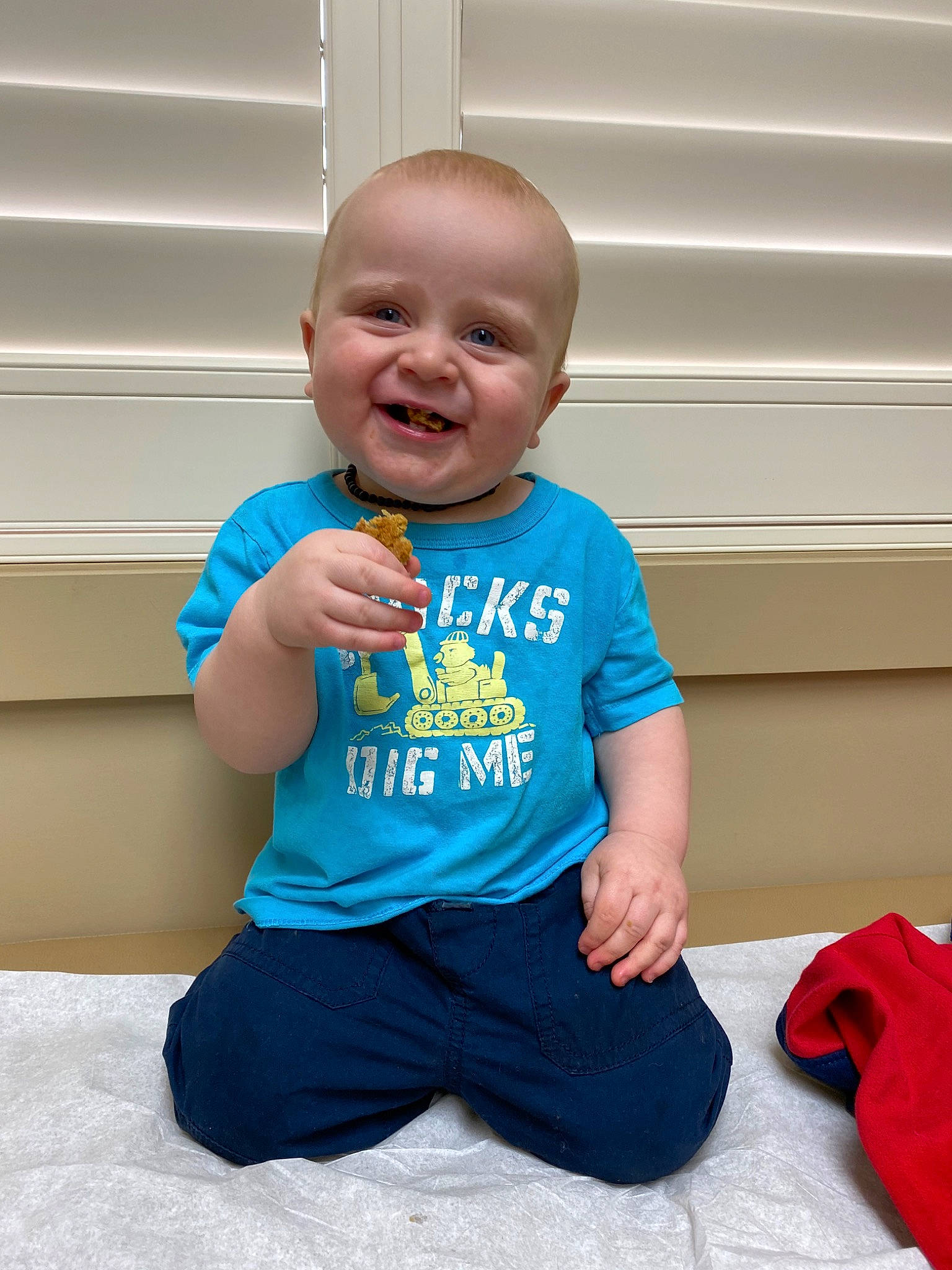 Jaxsyn is registered to the contest to win money with this photo: baby, baby_toddler_clothing, blue, child, joy, person, play, sitting, sleeve, smile, t_shirt, teal, toddler, turquoise