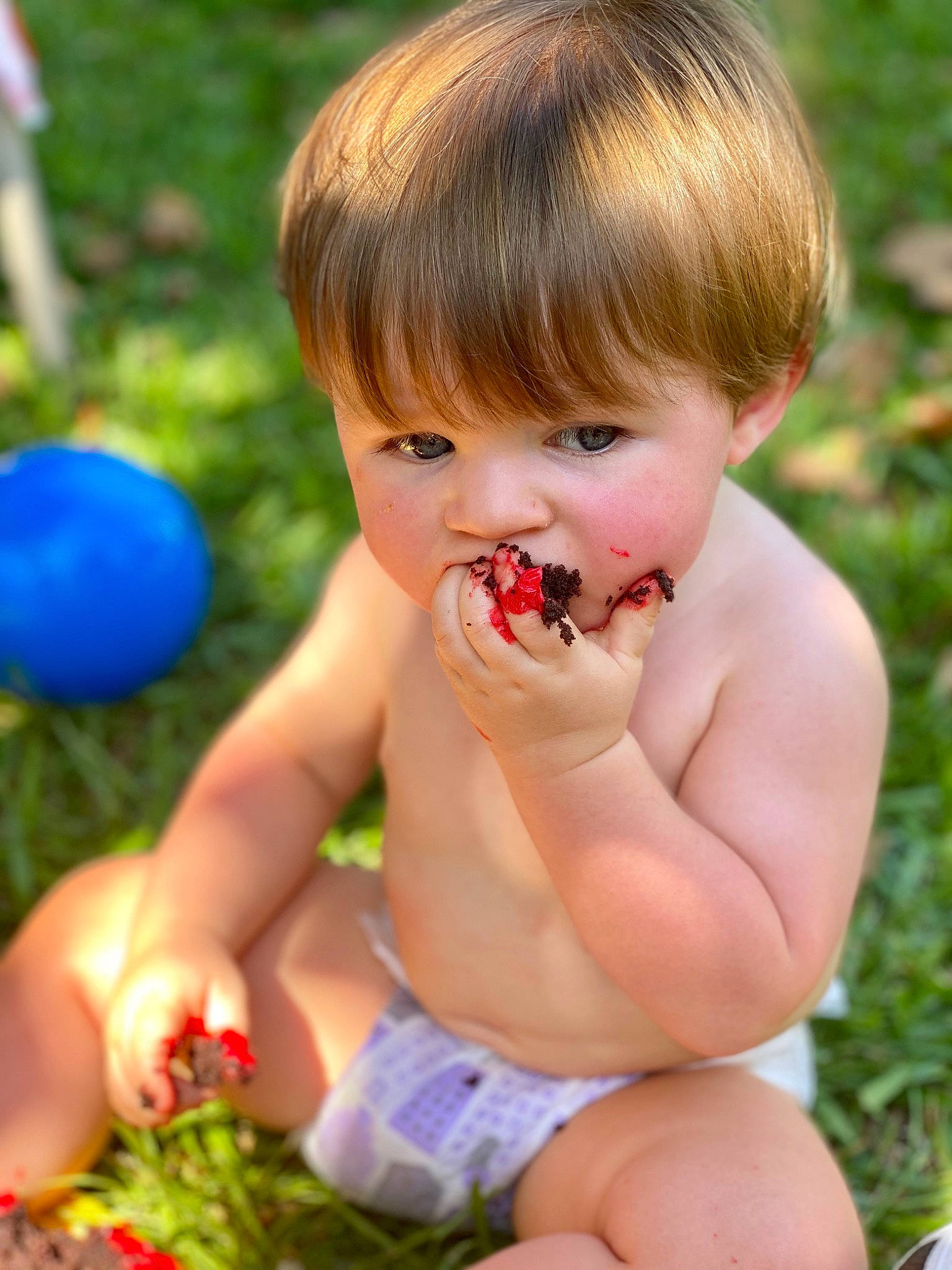 Kohen is registered to the contest to win money with this photo: baby, child, eating, finger, fun, grass, person, plant, play, smile, summer, toddler