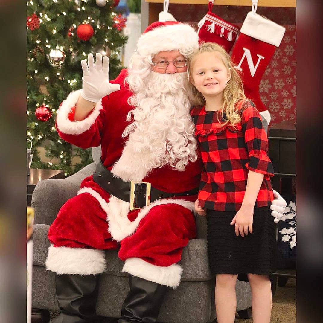 Harlie is registered to the contest to win money with this photo: beard, christmas, christmas_decoration, christmas_tree, event, fun, hair, happy, head, headwear, joy, lap, person, photograph, red, santa_claus, shoe, sleeve, smile, standing