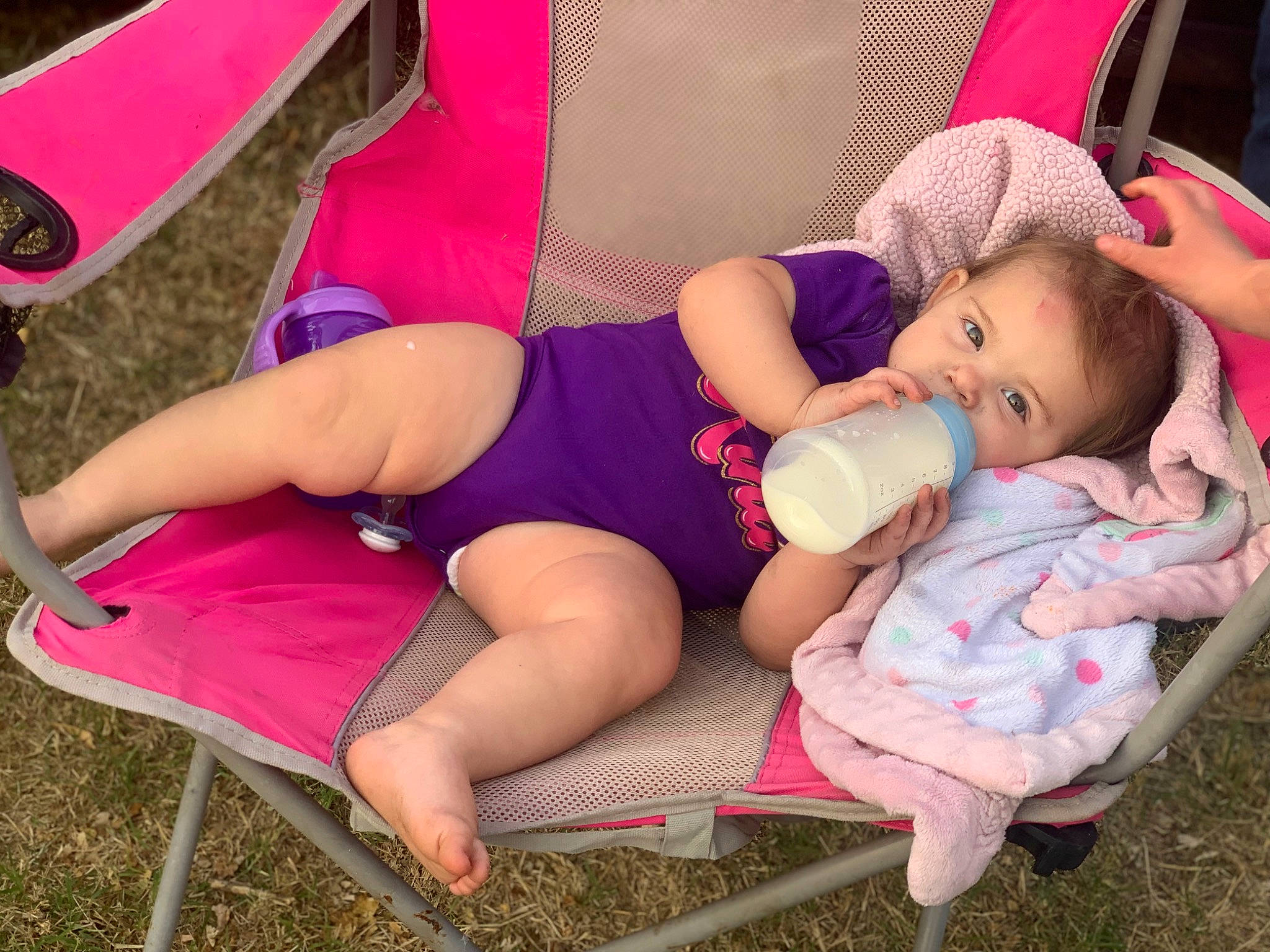 Calliope Rhayne joined the competition — help win amazing prizes! arm, baby_toddler_clothing, chair, comfort, fun, grass, happy, hat, knee, lap, leg, leisure, magenta, mouth, person, pink, shorts, skin, summer, thigh