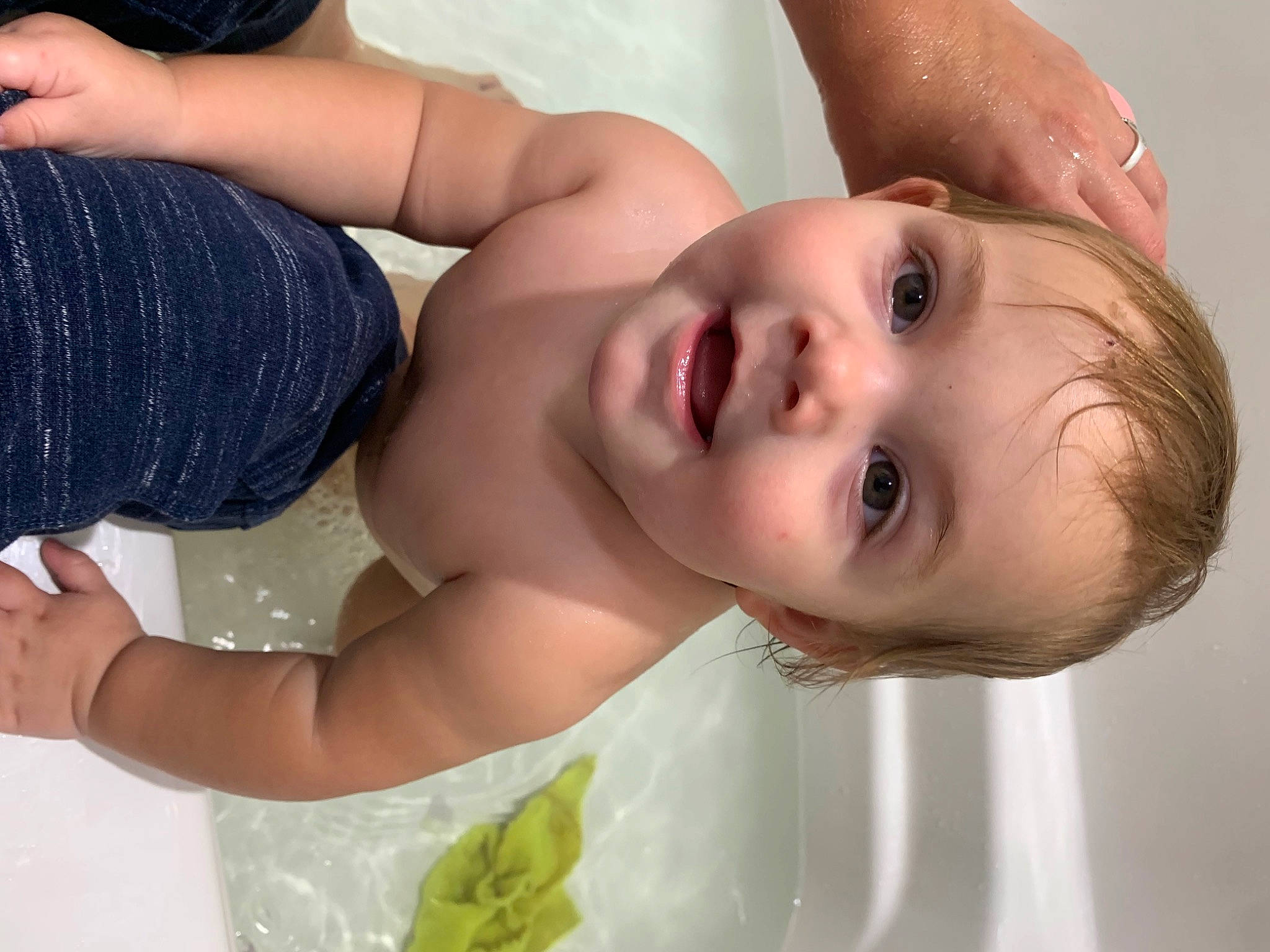 Calliope Rhayne is registered to the contest to win money with this photo: arm, baby, bathing, cheek, chest, eyelash, face, flash_photography, gesture, hair, hand, happy, human_body, joint, lip, mouth, neck, nose, person, skin