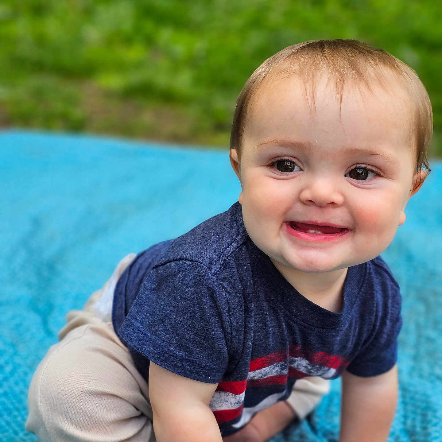 Kennedy joined the competition — help win amazing prizes! baby, beige_pants, blue_blanket, child, clothing, crawling, cute, eyes, face, feet, grass, hands, happy, infant, nature, outdoor, portrait, short_sleeve_shirt, smiling, toddler
