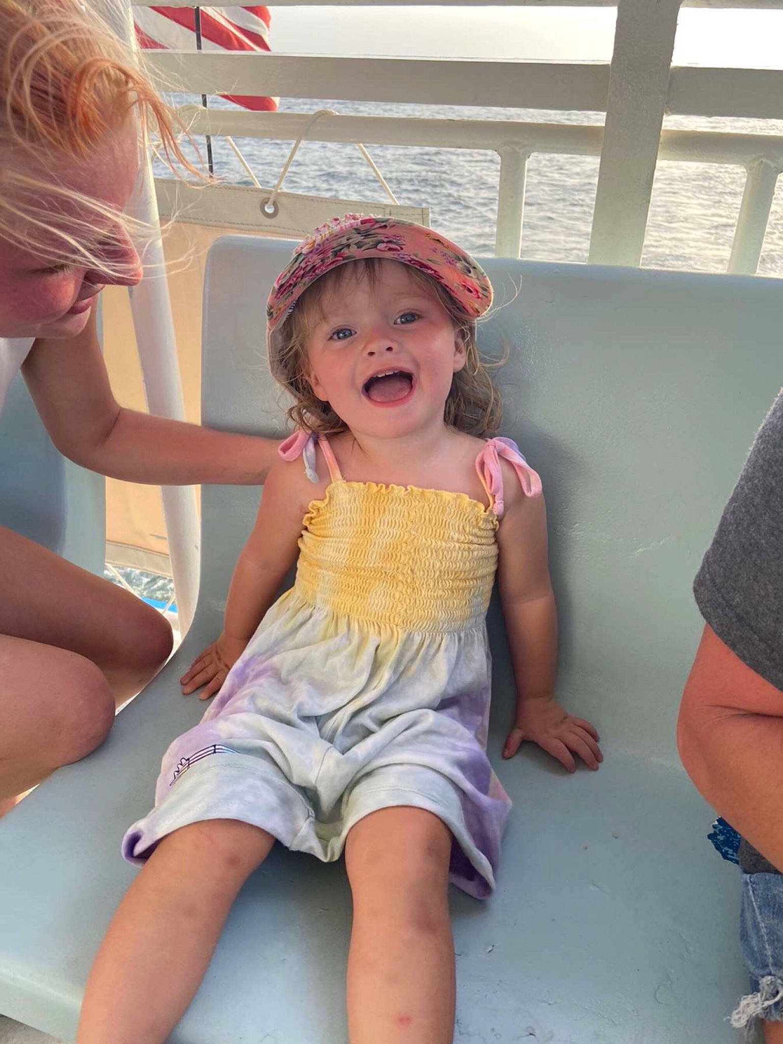 Harper joined the competition — help win amazing prizes! daytime, event, flag, fun, happy, hat, human_leg, knee, leg, leisure, person, pink, recreation, shorts, smile, summer, sun_hat, t_shirt, thigh, toddler