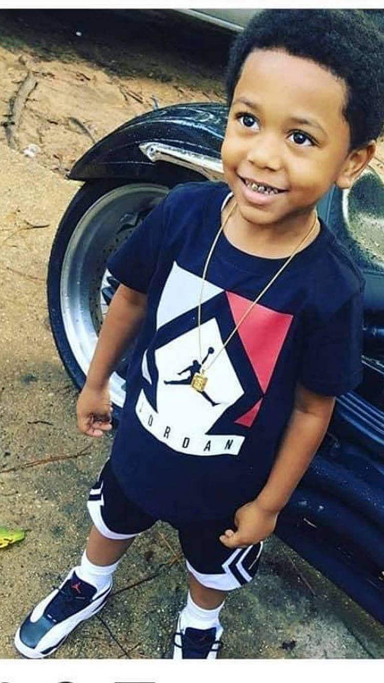 Santana joined the competition — help win amazing prizes! automotive_tire, automotive_wheel_system, black_hair, chin, cool, flash_photography, happy, joy, motor_vehicle, person, photograph, shorts, sleeve, smile, snapshot, sneakers, t_shirt, thigh, tire, toddler