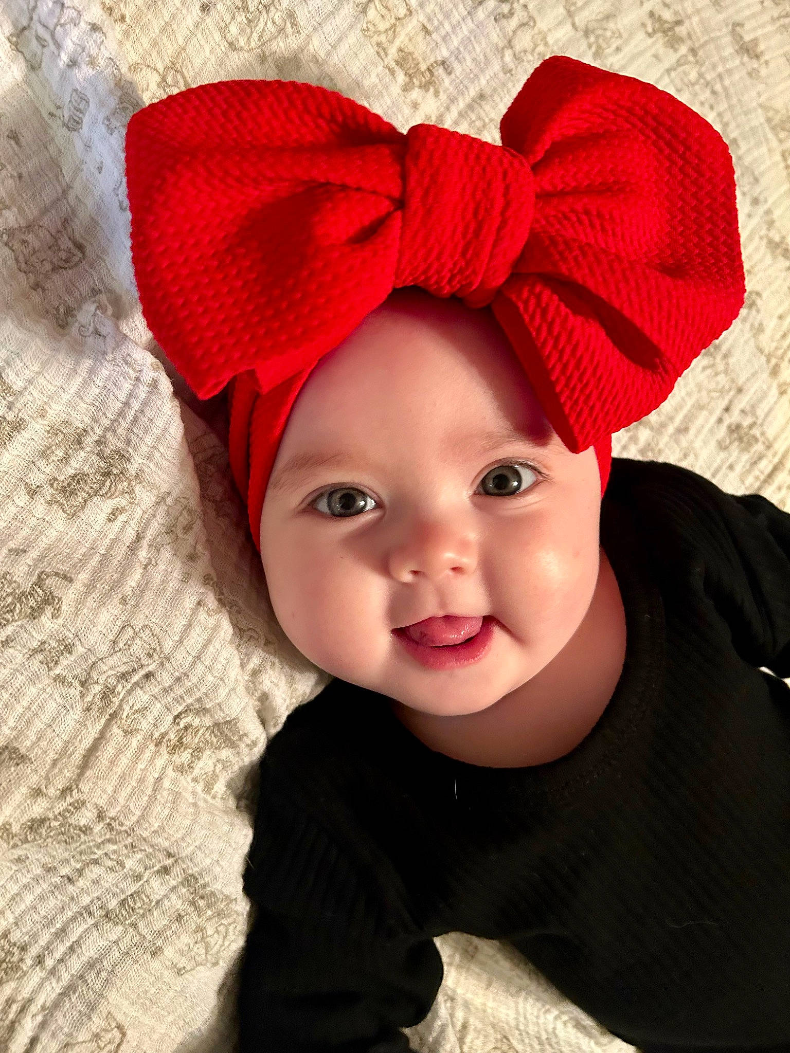 Scarlett is registered to the contest to win money with this photo: baby, baby_toddler_clothing, cap, child, clothing, cool, costume_hat, face, facial_expression, happy, hat, head, headgear, headwear, knit_cap, lip, magenta, outerwear, person, smile
