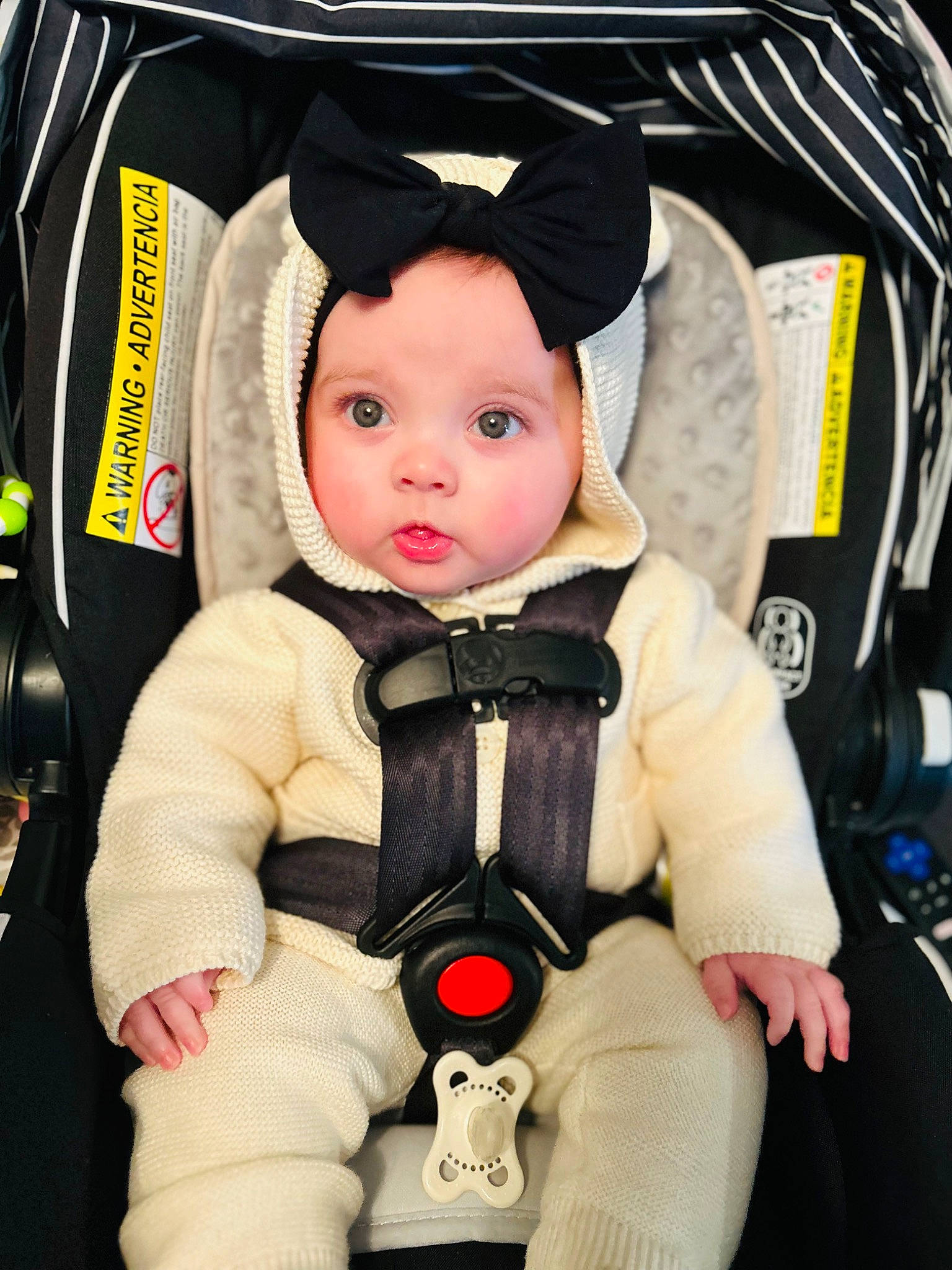 Scarlett joined the competition — help win amazing prizes! auto_part, baby, baby_carriage, baby_products, baby_safety, baby_toddler_clothing, bag, car_seat, carmine, cheek, child, comfort, doll, fashion_accessory, headwear, luggage_and_bags, person, sitting, stuffed_toy, toddler