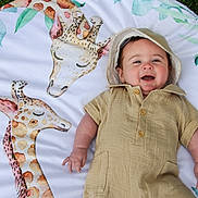 Luke joined the competition — help win amazing prizes! animal, applique, baby, blanket, bodypart, bonnet, clothing, face, finger, furniture, giraffe, happy, hat, head, pattern, person, photography, portrait, quilt, smile