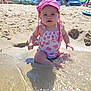 baby, child, beach, water, splashing, sunhat, swimsuit, sand, umbrella, sunny, trees, people, summer, vacation, outdoor, play, happy, cute, nature, holiday