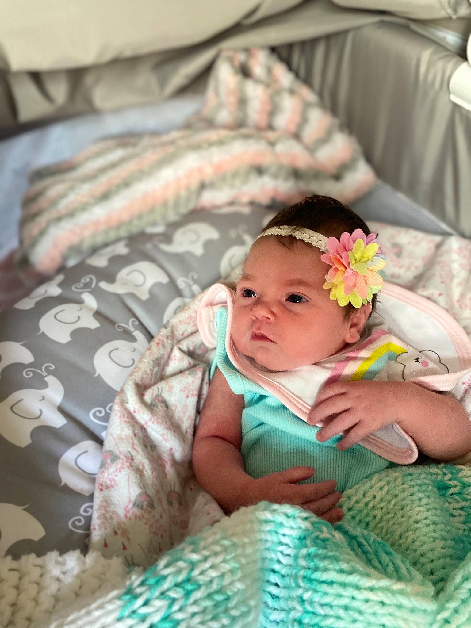 Emma is registered to the contest to win money with this photo: baby, baby_products, baby_toddler_clothing, bedding, bedtime, chair, child, comfort, couch, fashion_accessory, grass, headwear, jewellery, linens, nap, pattern, person, portrait_photography, room, sitting