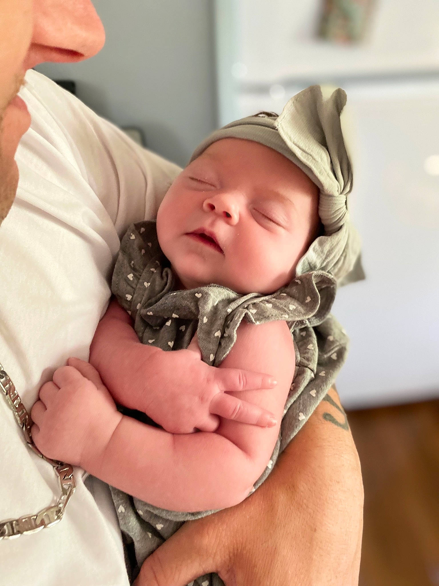 Emma is registered to the contest to win money with this photo: baby, baby_products, baby_toddler_clothing, cap, cheek, chest, child, comfort, eye, eyebrow, eyelash, finger, gesture, hand, hat, mouth, pattern, person, skin, thumb