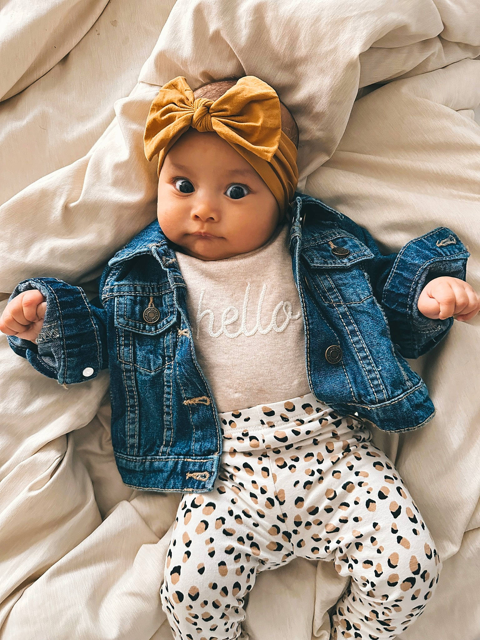 Emma is registered to the contest to win money with this photo: baby_toddler_clothing, child, doll, electric_blue, eye, eyelash, fashion_design, fawn, headwear, linens, outerwear, pattern, person, skin, sleeve, textile, thigh, toy, waist, white