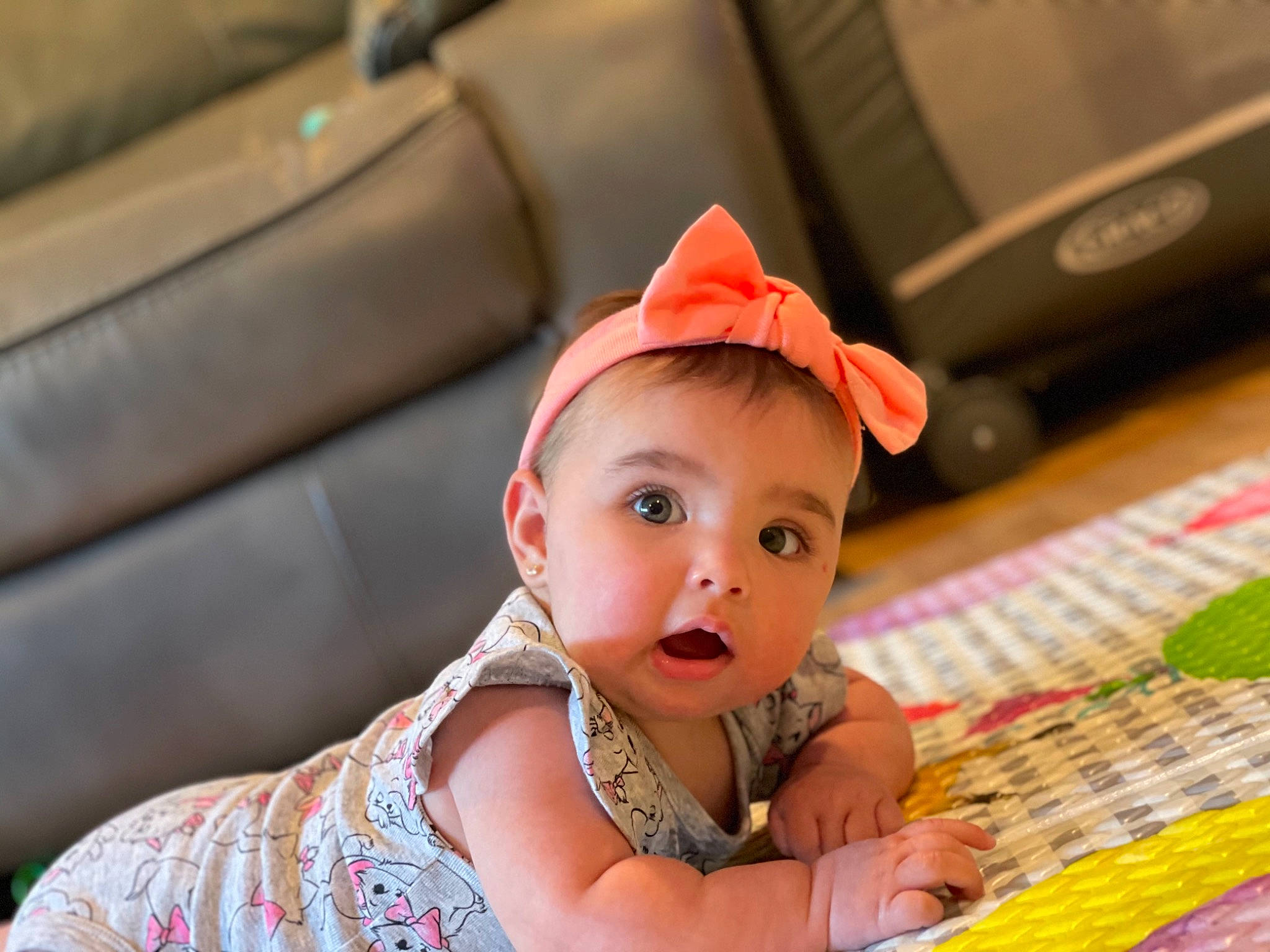 Meadow is registered to the contest to win money with this photo: baby, baby_toddler_clothing, cap, child, computer_keyboard, family_car, fashion_accessory, fun, happy, leisure, pattern, person, portrait_photography, sitting, surprise, toddler, vacation