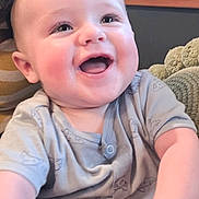 Roman joined the competition — help win amazing prizes! baby, smiling, happy, child, onesie, indoor, cute, face, infant, rosy_cheeks, joyful, sitting, person, childhood, portrait, cozy, blanket, wooden_background, expression, cute_outfit