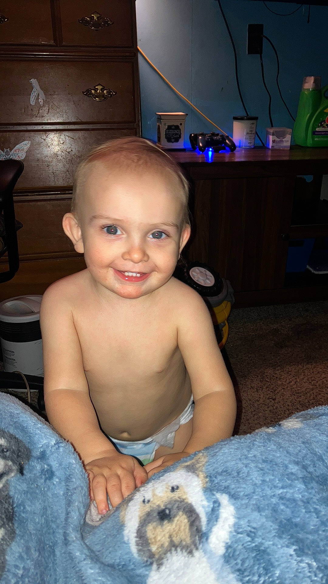 Paxton is registered to the contest to win money with this photo: barechested, blue, carnivore, cheek, chest, child, companion_dog, dog, dog_breed, flash_photography, flooring, fun, happy, head, houseplant, joy, person, room, sitting, smile