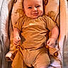 Blake joined the competition — help win amazing prizes! baby, infant, smile, dimples, bassinet, blanket, brown_clothing, socks, cute, happy, portrait, indoor, child, face, person, comfort, resting, babywear, newborn, cozy