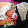 Jordyn is registered to the contest to win money with this photo: baby, newborn, sleeping, pacifier, blanket, cozy, infant, hand, soft, bed, cute, peaceful, child, indoor, portrait, resting, clothing, floral, toddler, comfort