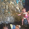 Khealani joined the competition — help win amazing prizes! art, baby, casual, child, clothing, colorful, crawling, curiosity, dim_lighting, exhibit, fish_sculpture, floor, holding, indoor, person, play, recycled_materials, sandals, sculpture, shorts