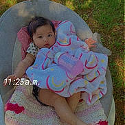 Khealani joined the competition — help win amazing prizes! baby, baby_bottle, blanket, bottle, chair, child, clothing, crochet_blanket, cute, face, foot, grass, hand, infant, outdoor, person, rainbow_pattern, relaxing, sitting, time_overlay