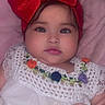 Khealani joined the competition — help win amazing prizes! baby, child, red_bow, headband, white_dress, embroidery, pink_blanket, cute, face, hand, portrait, infant, soft, indoors, young_child, chubby_cheeks, fashion, colorful, closeup, person