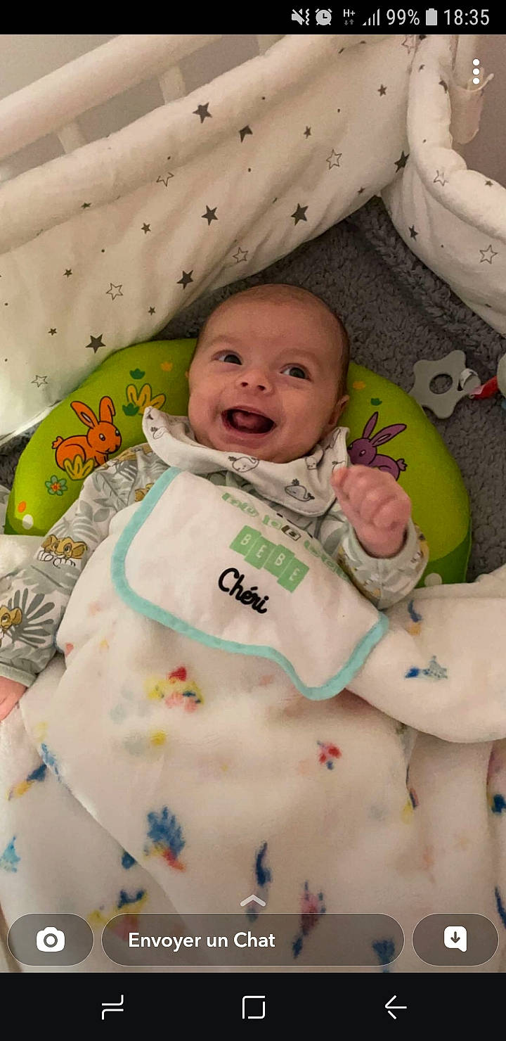 Juliann a rejoint le concours — aidez-le/la à gagner de superbes lots ! baby, baby_safety, baby_toddler_clothing, cheek, child, comfort, face, finger, happy, infant_bed, linens, mouth, person, pink, product, skin, sleeve, smile, textile, toddler