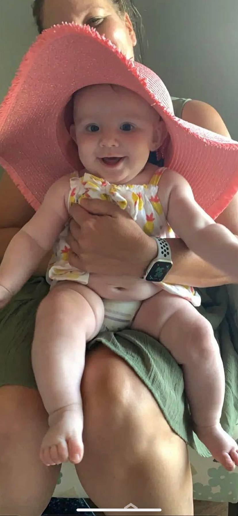 Kimber is registered to the contest to win money with this photo: baby, cheek, chest, finger, hand, happy, headwear, human_body, joint, joy, knee, lap, leg, mouth, muscle, organ, person, pink, skin, smile