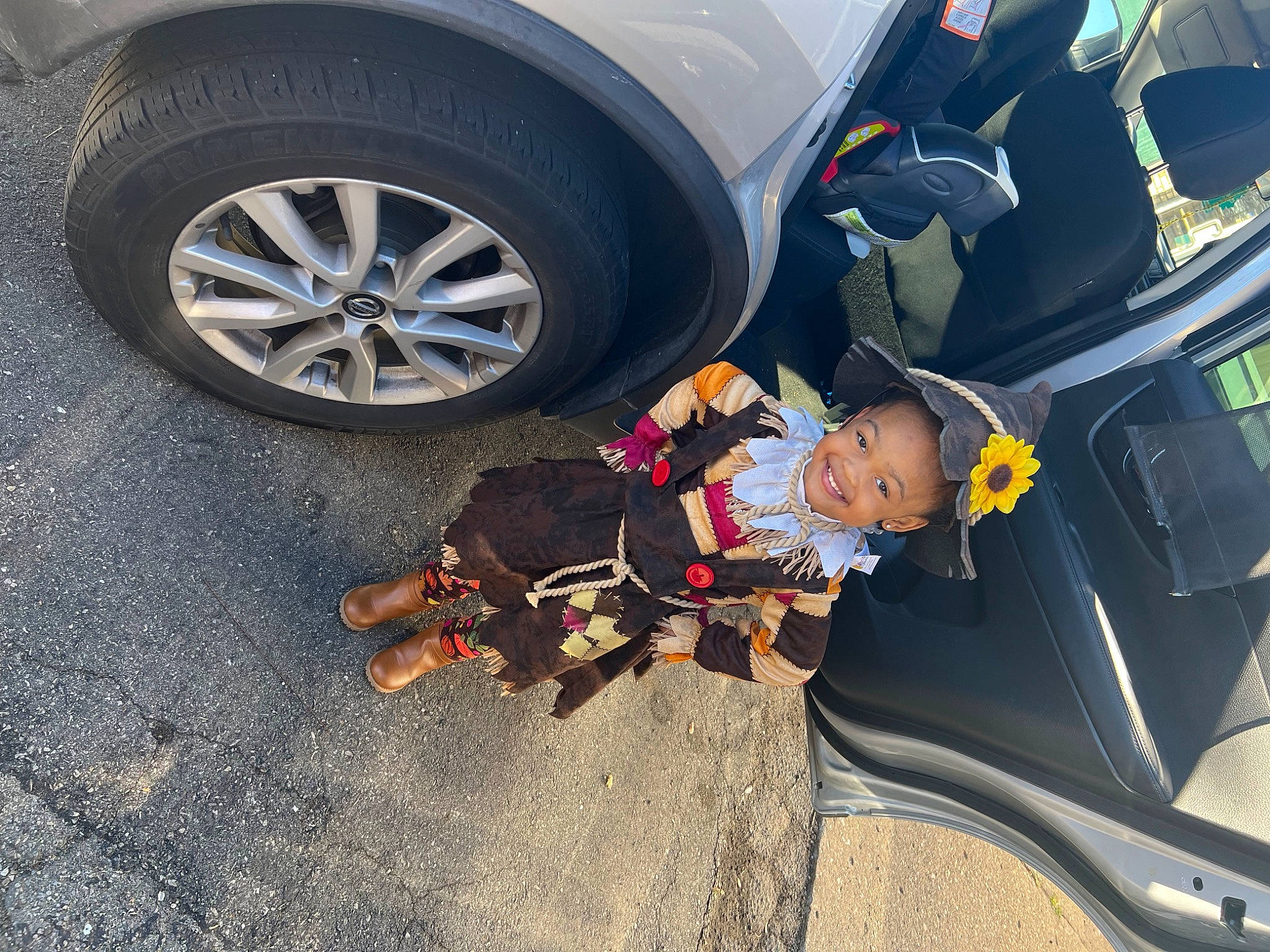 Morgan is registered to the contest to win money with this photo: alloy_wheel, asphalt, auto_part, automotive_design, automotive_exterior, automotive_lighting, automotive_tire, bumper, car, fender, hood, hubcap, joy, motor_vehicle, person, personal_luxury_car, tire, tread, vehicle, vehicle_door