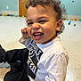Jayceon joined the competition — help win amazing prizes! baby, babylaughing, bodypart, clothing, coat, face, happy, head, jacket, laughing, mouth, pants, person, photography, portrait, sitting, smile, teeth