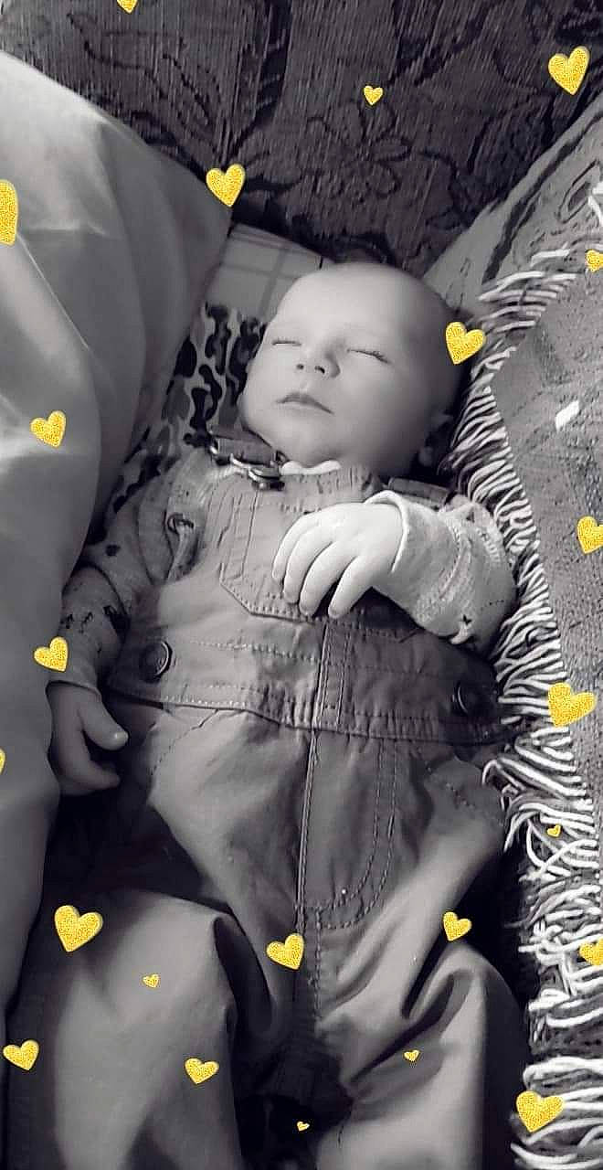 Lucas is registered to the contest to win money with this photo: baby, black_and_white, child, person, photograph, photography, plant, smile, toddler, yellow