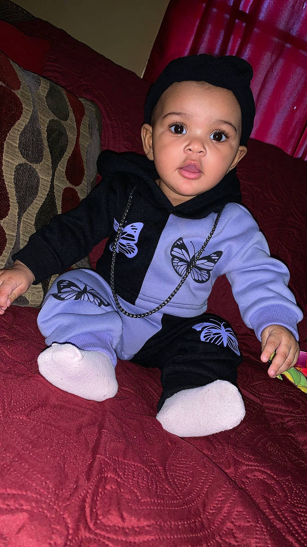 Ayana is registered to the contest to win money with this photo: baby, baby_toddler_clothing, cheek, child, comfort, cool, eye, face, flash_photography, flooring, hairstyle, head, pattern, person, pink, skin, sleeve, sock, t_shirt, textile