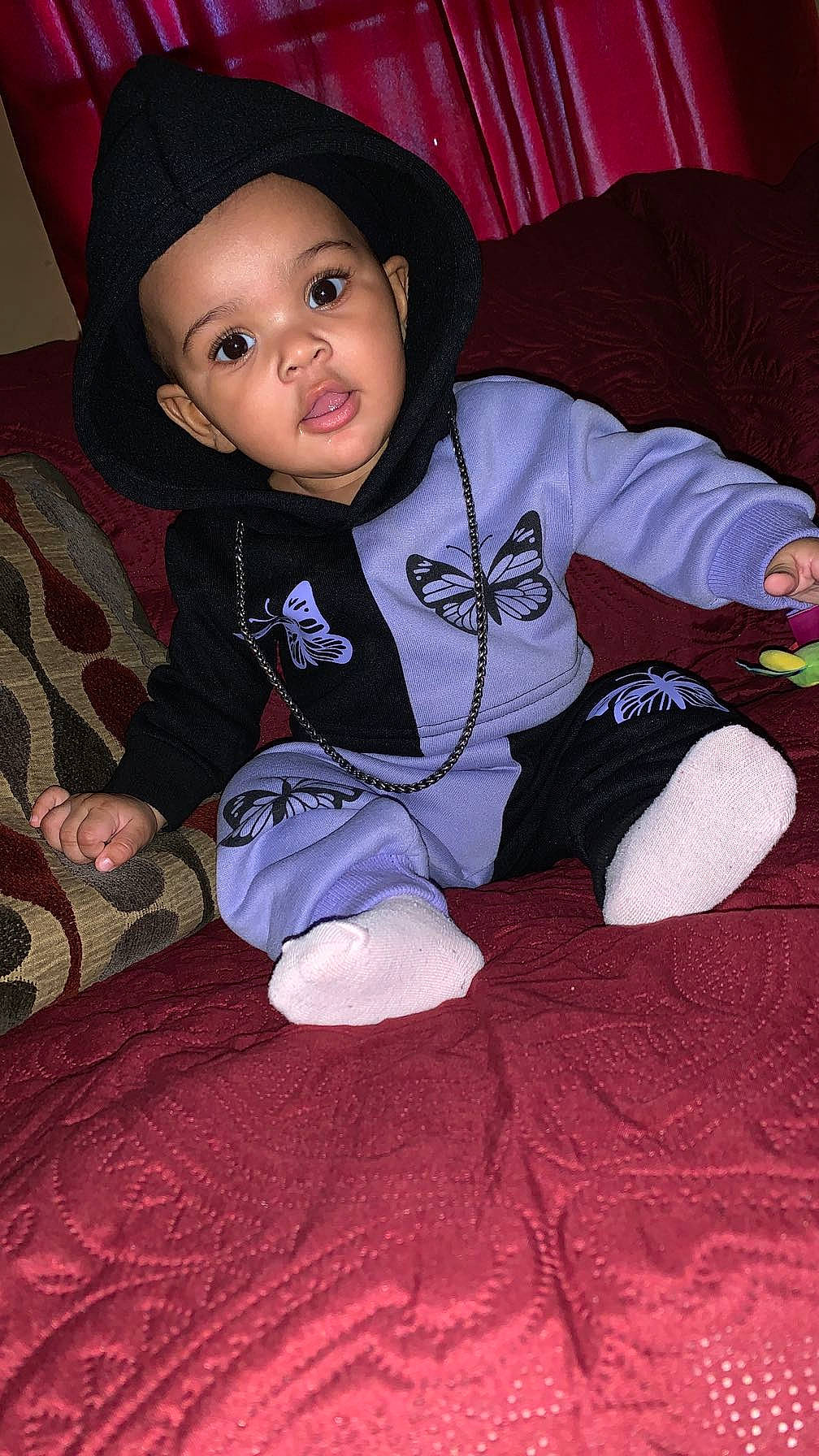 Ayana is registered to the contest to win money with this photo: baby, baby_toddler_clothing, cheek, child, comfort, face, facial_expression, flash_photography, fun, hairstyle, lap, person, pink, red, sitting, skin, sleeve, smile, t_shirt, toddler