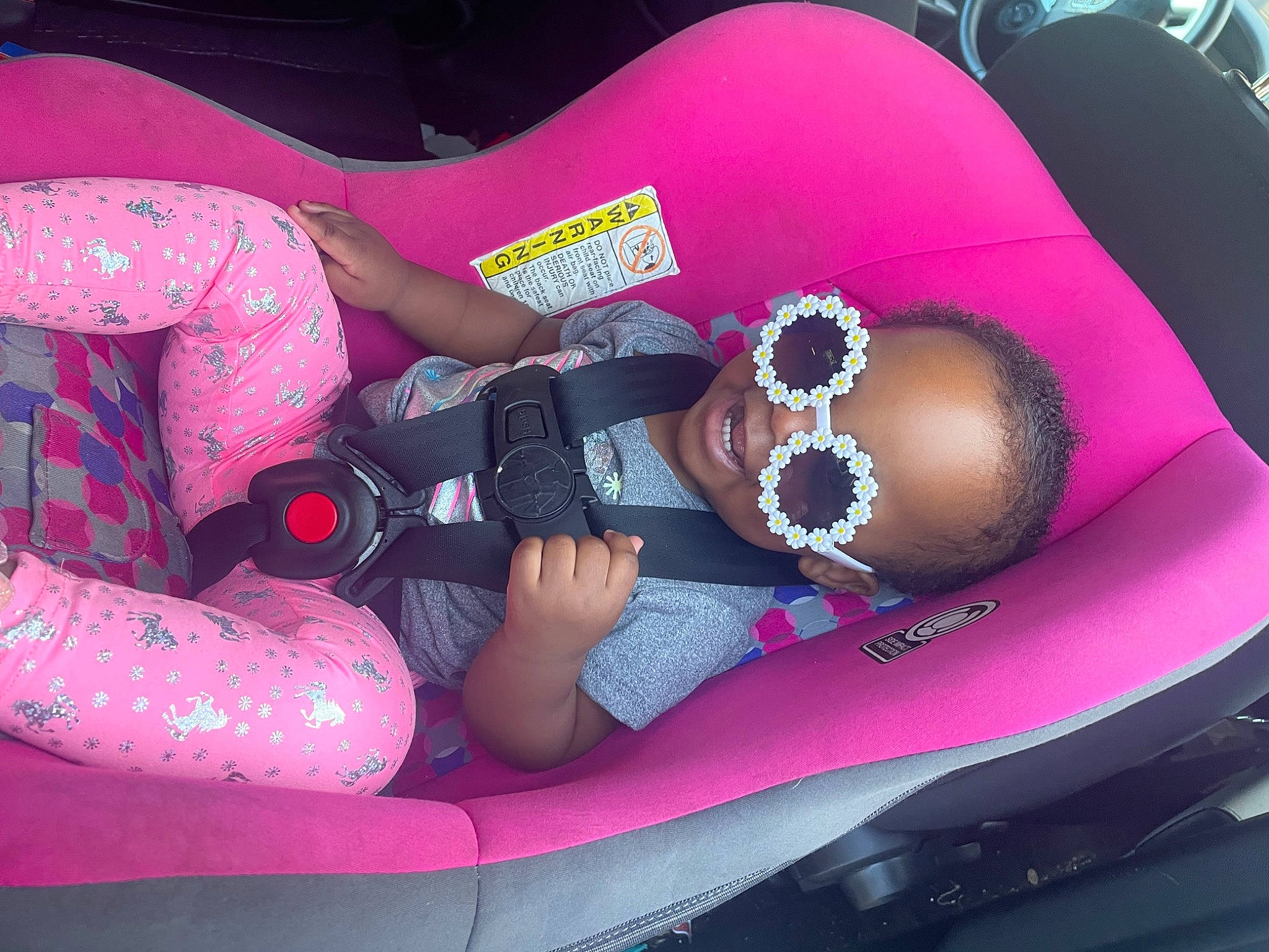 Reign is registered to the contest to win money with this photo: auto_part, automotive_design, automotive_exterior, black_hair, bumper, car_seat, car_seat_cover, comfort, cool, finger, fun, magenta, motor_vehicle, mouth, nail, person, pink, product, purple, thigh