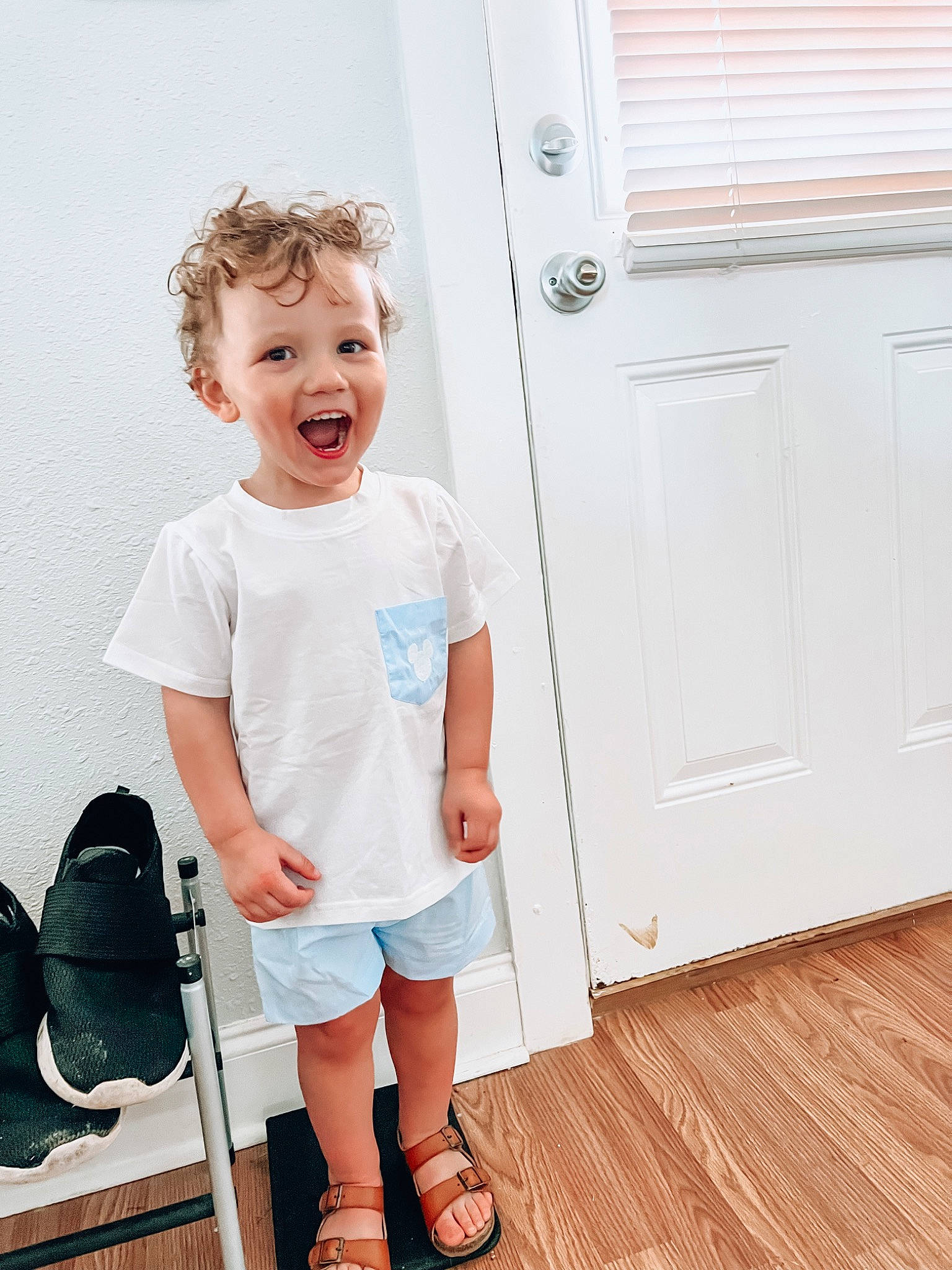 Raidyn joined the competition — help win amazing prizes! baby_toddler_clothing, bag, child, door, flooring, happy, hardwood, home_door, human_leg, knee, luggage_and_bags, pattern, person, shorts, sleeve, smile, toddler, waist, window_blind, wood